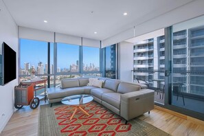 Get comfortable in the living room. There’s a recliner sofa and TV for your evening entertainment.