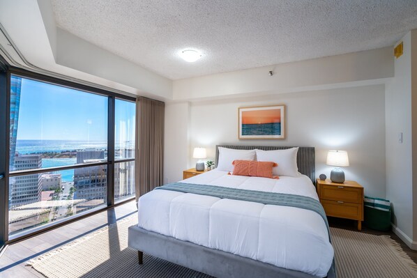 Spacious Primary Bedroom with Ocean and City Views