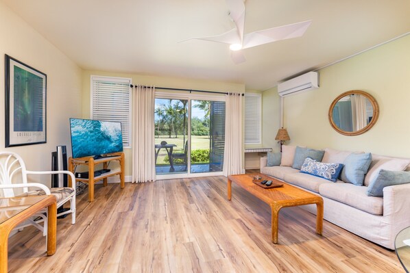 Spacious Living Area with Split AC Unit and Golf Course Frontage