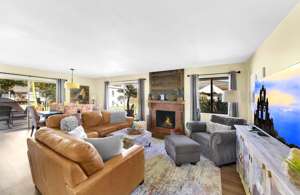 Family room with fireplace and dining area