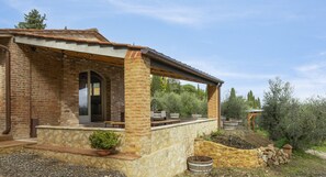 A shaded pergola at the front of the house is a perfect spot to hang out