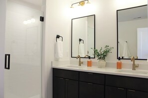 sink and shower area of the master bathroom 