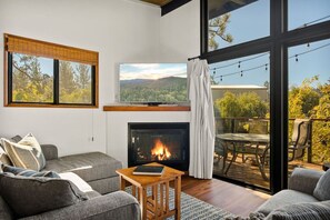 Enjoy the living room featuring a Smart TV for streaming along with a gas fireplace.