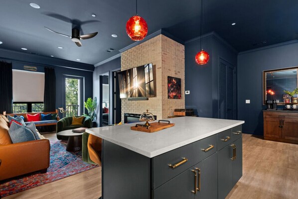 A beautifully designed kitchen with an open view of the living room, creating a seamless flow for cooking and entertaining.