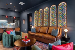 Featuring elegant decor, rich tones, and stunning stained glass accents in the living room