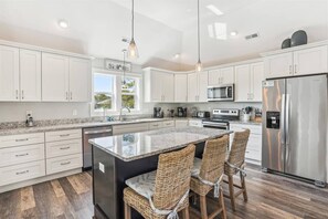 Eat-in Kitchen, see your family/friends over looking the living room