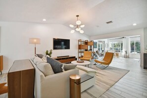 Living room with frame TV and seating