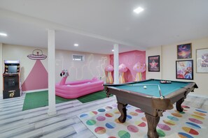 Whimsical Pool Table Corner: Pool table nestled in a vibrant corner
