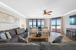 Spacious living room with Gulf view and balcony access