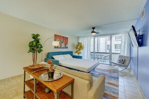 The condo sleeps 4 total—2 on the king bed and 2 on this queen-size pull-out sofa, shown here made up for a cozy night's rest.