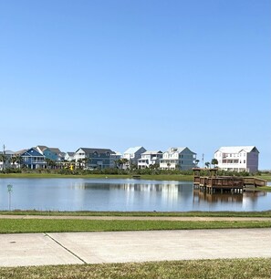 IN FRONT OF THE CONDOS IS A GREAT POND WITH PIER