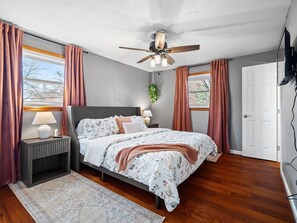 Effortless elegance.  This bedroom boasts a sophisticated blend of textures and colors.  The king-sized bed is the perfect centerpiece.