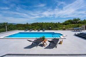 A private 8m x 4m  swimming pool
