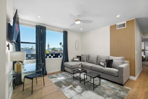 Relax in Style: Cozy living room, smart TV, and streaming apps for movie nights.