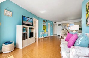 Unwind in our cozy living area featuring a TV for your entertainment