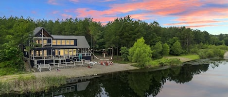 Nestled by a tranquil pond and framed by lush trees, this cabin is your perfect nature escape.