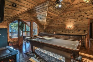 Challenge friends to a game of pool or unwind with arcade classics in a cozy, wood-paneled retreat.