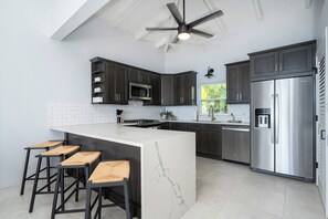 full kitchen featuring new appliances