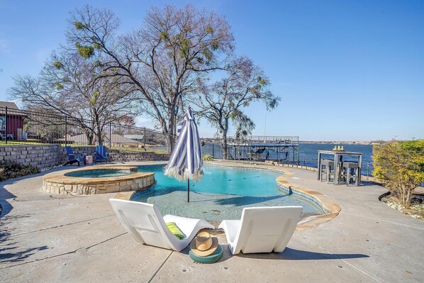 Relax by the sparkling pool with serene lakeside views. Pure bliss awaits!
