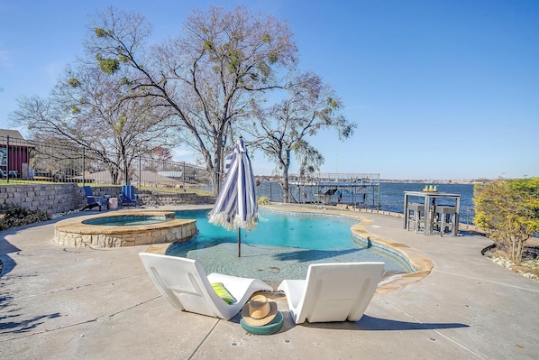 Relax by the sparkling pool with serene lakeside views. Pure bliss awaits!
