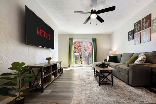 Unwind in our cozy living room with a spacious sofa, natural light, and stylish decor. Perfect for relaxing after a day at Bella Terra Vineyards or enjoying a quiet night in—your home away from home awaits!