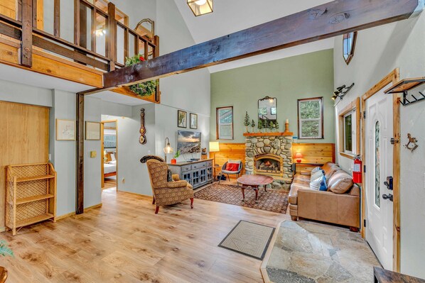 Living Room: 3-person couch, 4 chairs, 50” Smart TV, gas fireplace
