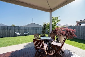 Outside deck with access to lawned back yard