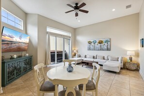 Kick back in a spacious living room with a sliding door that brings in great views and leads straight to the hot tub for ultimate relaxation!