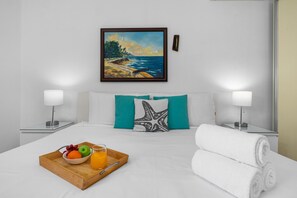Master Bedroom: kng-size bed, ensuite bathroom, smart TV, air conditioning.