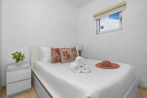 Enjoy a comfortable queen-sized bed with plush pillows. (All of the blankets, sheets, and beach and bath towels are cleaned and ready to use.)