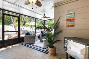 Relax on the outdoor patio with stunning views of the sparkling pool.