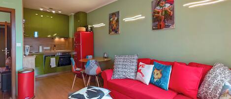 Fully equipped kitchen, dining table seats 4, sofa extends to sleep 2, SMART TV.
