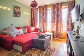 The sofa bed extends to sleep two people and there is a SMART TV.