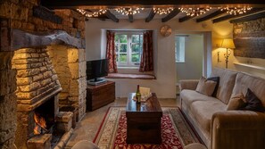 Flagstone flooring, exposed Cotswold stone and wooden beams add character