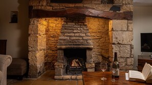 Light the fire in its large inglenook surround