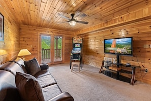 The lower-level game room is a paradise for relaxation & gaming alike