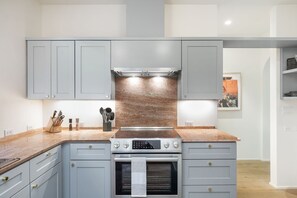 Whip up culinary delights in our modern, fully equipped kitchen!