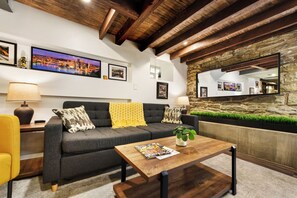 Unique wall art and cozy vibes complete the living space.