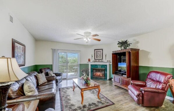 Spacious Living Room with Gas Fireplace, Sleeper Sofa and SMART TV with Cable & WIFI throughout vacation rental