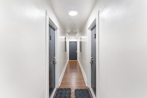 Common area hallway leads to your private apartment in the heart of downtown. 