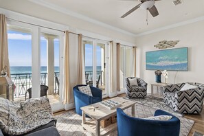 Living Room with a large comfortable sectional, Gulf views, and a HUGE 75” Smart TV - watch the big game with a view!