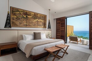 Ocean-view master bedroom with king-size bed