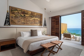 Ocean-view master bedroom with king-size bed