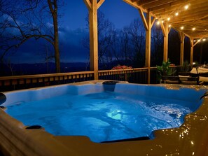 Imagine soaking in the warm water of our hot tub, surrounded by the peaceful night and twinkling string lights. This is the perfect end to a day.