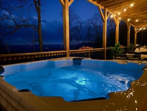 Imagine soaking in the warm water of our hot tub, surrounded by the peaceful night and twinkling string lights. This is the perfect end to a day.