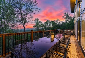 Imagine ending your day with this view! Our deck transforms into a magical dining space at sunset, offering a front-row seat to Blue Ridge Mountain's spectacular scenery. The expansive table and comfortable seating create the perfect setting for unforgett