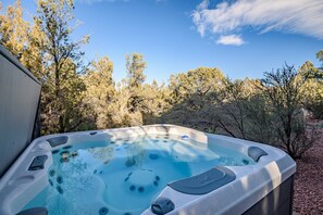 Enjoy soaking in the midst of the green trees.