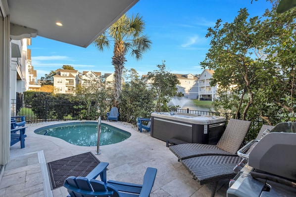 Cozy and secluded pool deck is perfect for entertaining and chilling poolside