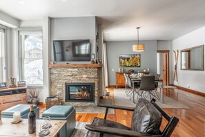 Living Room has upgraded TV w/ smart features and gas burning fireplace.