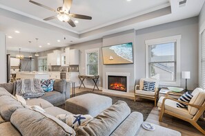 Spacious and well-lit living area, great for movie time, fun chats, or enjoying your morning coffee. The open layout offers plenty of room to relax.